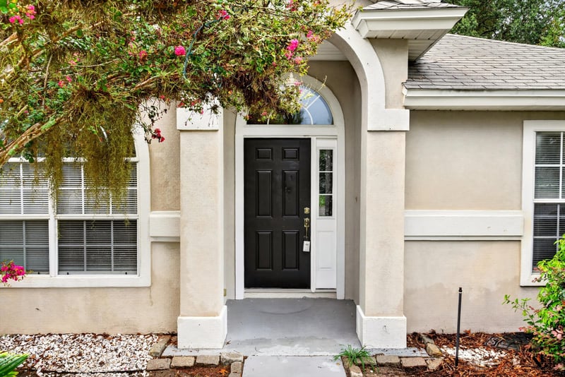 Front door with arched window at 12949 Chets Creek Dr S, Jacksonville, FL 32224