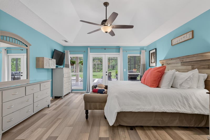 Primary bedroom with bed and large windows at 2304 Spring Hill Ct, Orange Park, FL