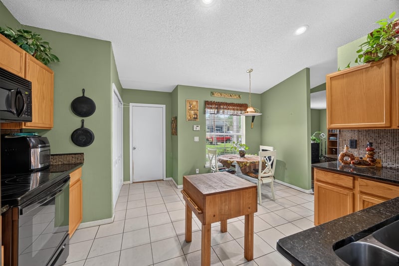 Kitchen view toward breakfast area at 145 Dover Bluff Dr, Orange Park, FL