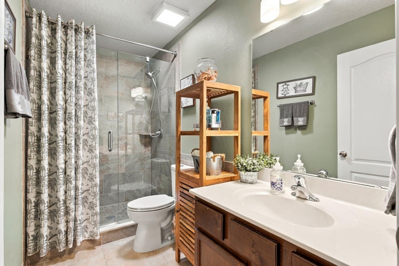 Secondary bedroom with four-poster bed and ceiling fan at 10923 Black Diamond Ct, Jacksonville, FL