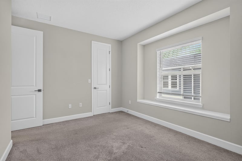 Bedroom with window and carpet at 7446 Loggerhead Ct, Jacksonville, FL 32256