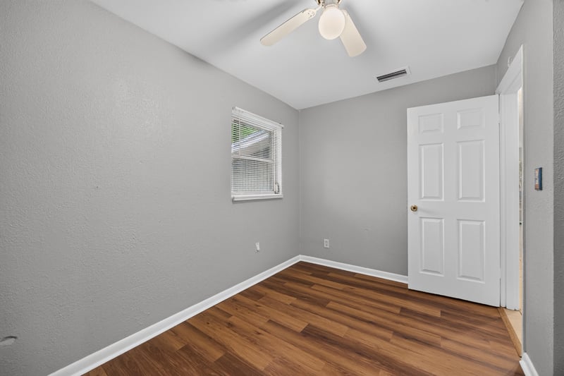 Empty room with window and door at 4030 Leonard Cir W, Jacksonville, FL 32209
