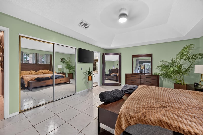 Primary bedroom with mirrored closet doors at 1346 Gately Ct, Jacksonville, FL 32225