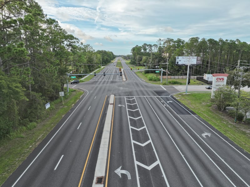 Street-level view of US-1 with signage and tree line at 4900 US-1, St. Augustine, FL 32086