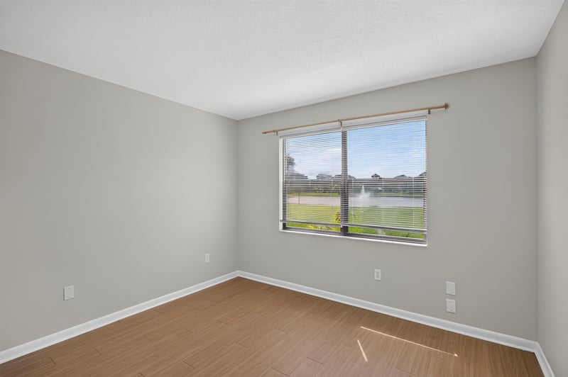 Bedroom with window and water view at 700 W Pope Rd unit h61, St. Augustine, FL 32080