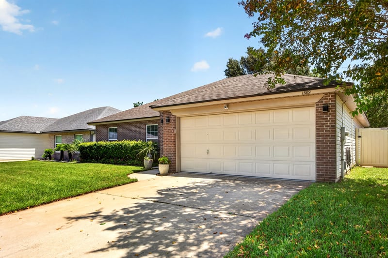 Front exterior and driveway at 1589 Backwater Drive, Middleburg, FL 32068