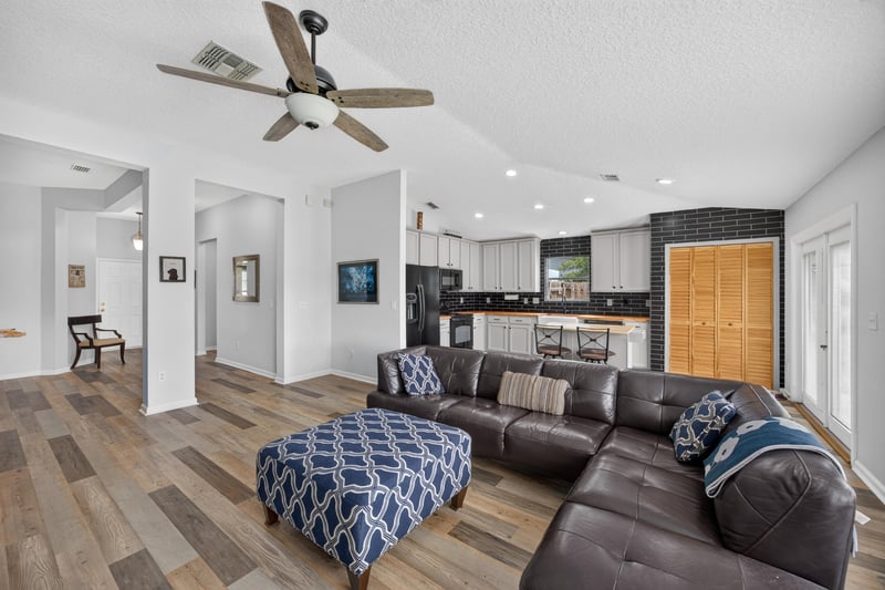 Living area with sectional sofa and hallway view at 2065 Creekmont Dr
