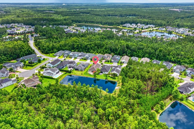 Aerial view of neighborhood pond in St. Johns, FL