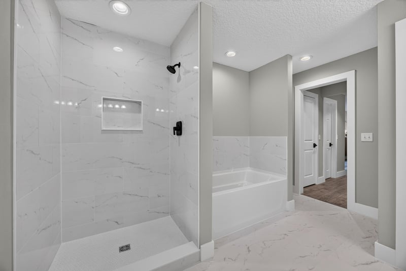 Bathroom with glass shower and soaking tub at 1161 Whispering Pines Rd, Jacksonville, FL 32259