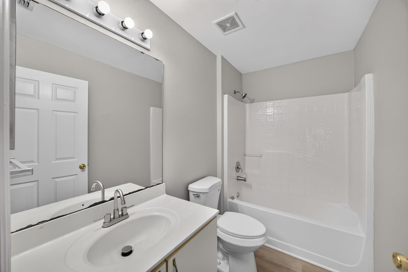 Second bathroom vanity and mirror at 1845 Saga Ct, Middleburg, FL