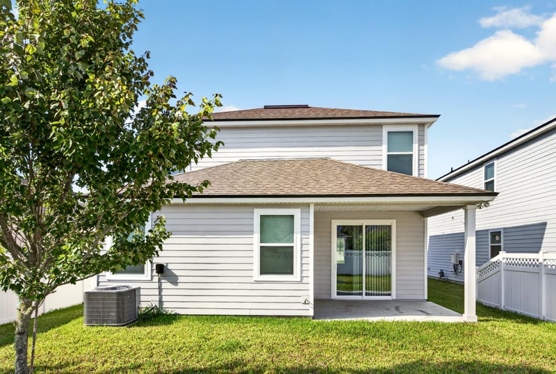 Backyard view with lawn and patio at 331 Millerstone Dr, St. Augustine, FL 32092