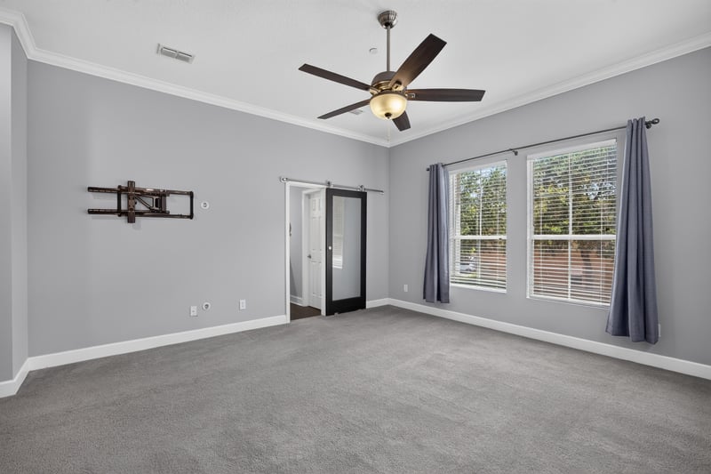 Upstairs flex room with windows and carpet at 6217 Eclipse Cir, Jacksonville, FL 32258