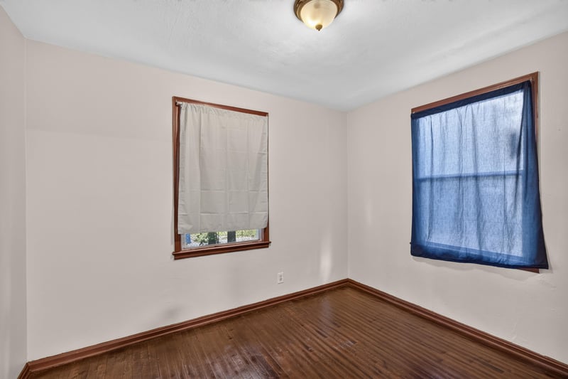 Empty bedroom with window and hardwood floor at 2132 Allandale Cir W, Jacksonville, FL