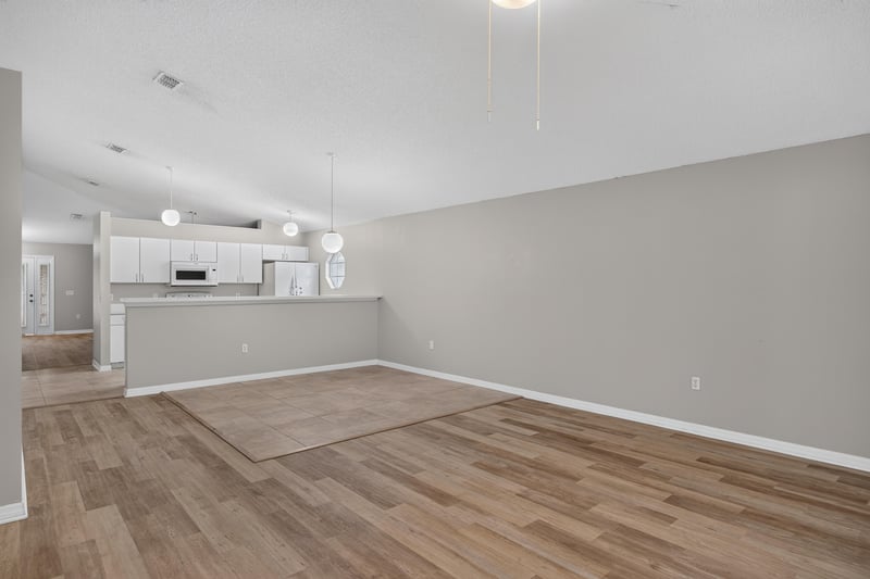 Dining space with wood-look flooring at 1845 Saga Ct, Middleburg, FL