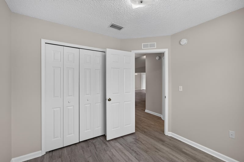 Bedroom closet doors and hallway at 8519 Blazing Star Ct, Jacksonville, FL 32210