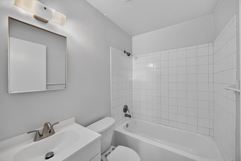Bathroom with tiled tub and shower and sink at 328 Palos Ct, St. Augustine, FL