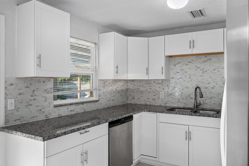 Kitchen with granite counters and tile backsplash at 442 Ameca Ave, Orange Park, FL 32073