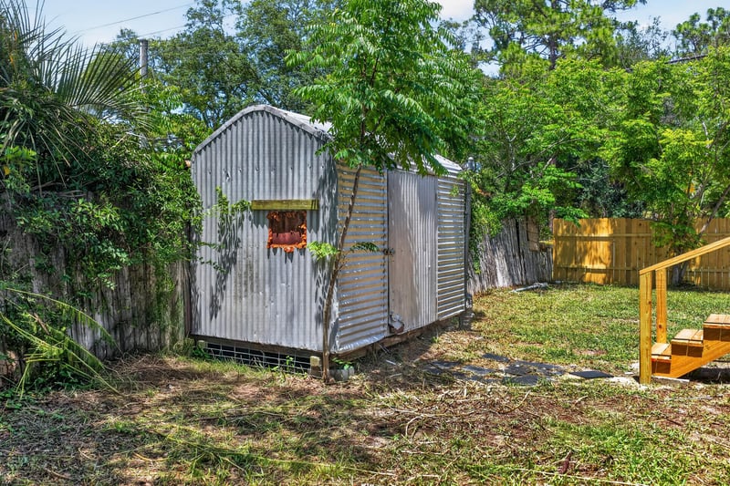 Backyard with metal storage shed at 7603 Coach Park Dr, Jacksonville, FL 32244