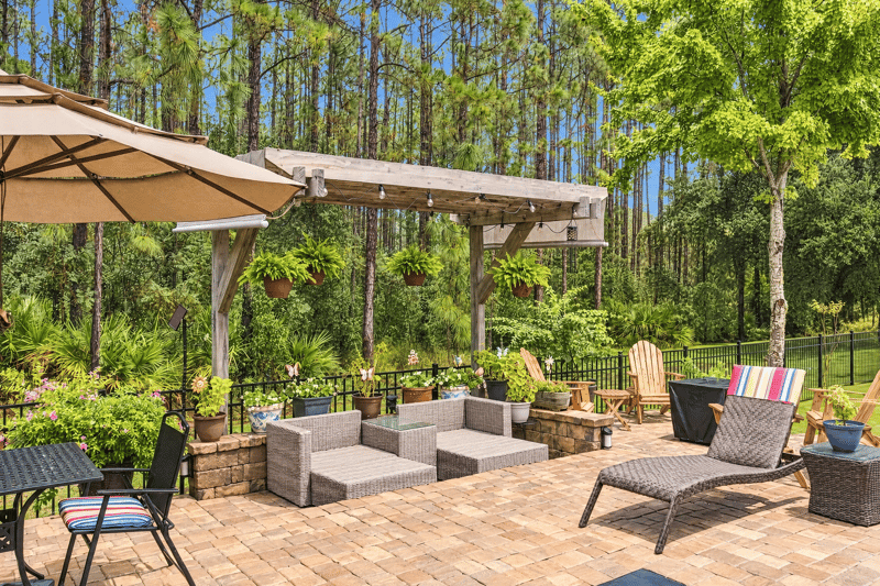 Patio with pergola and outdoor seating at 10923 Black Diamond Ct, Jacksonville, FL