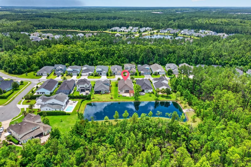 Aerial view of neighborhood pond in St. Johns, FL