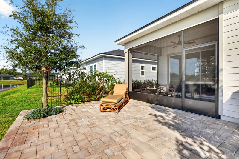 Paver patio and screened lanai in the backyard at 129 Amberwood Dr, St. Augustine, FL