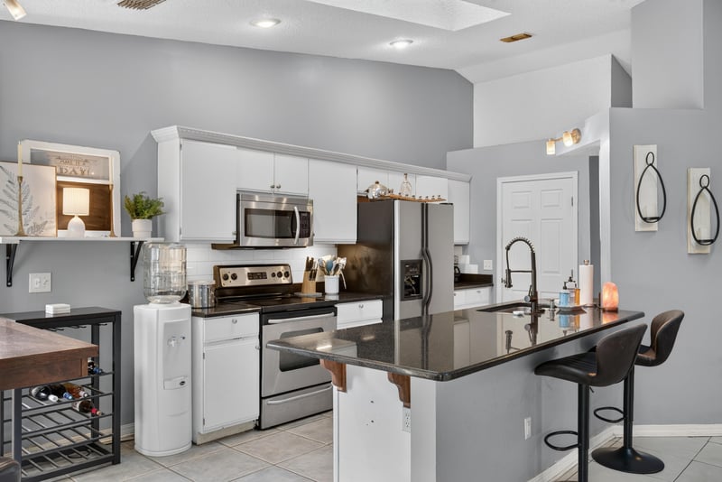 Kitchen island with bar seating at 13020 Medford Ln, Jacksonville, FL 32225