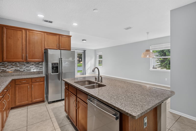 Kitchen island view toward living room at 13685 Goodson Pl, Jacksonville, FL 32226