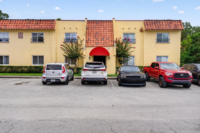 Front exterior with parking area at 3866 Campenero Ct unit 6, Jacksonville, FL 32217