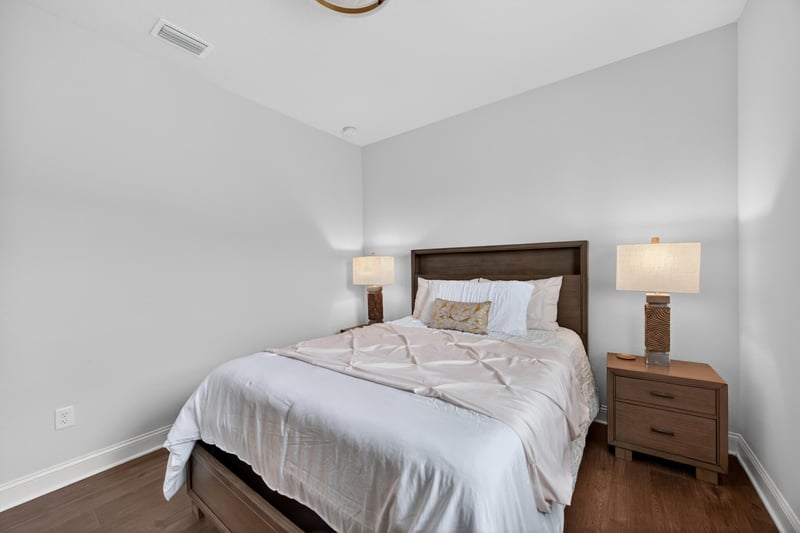 Bedroom with wood nightstands at 85491 Fall River Pkwy, Fernandina Beach, FL 32034