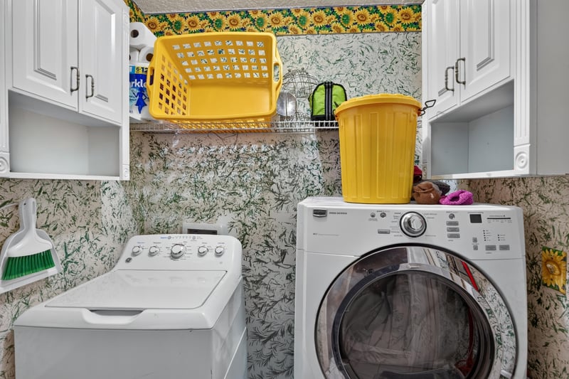 Laundry closet with patterned wallpaper at 1346 Gately Ct, Jacksonville, FL 32225