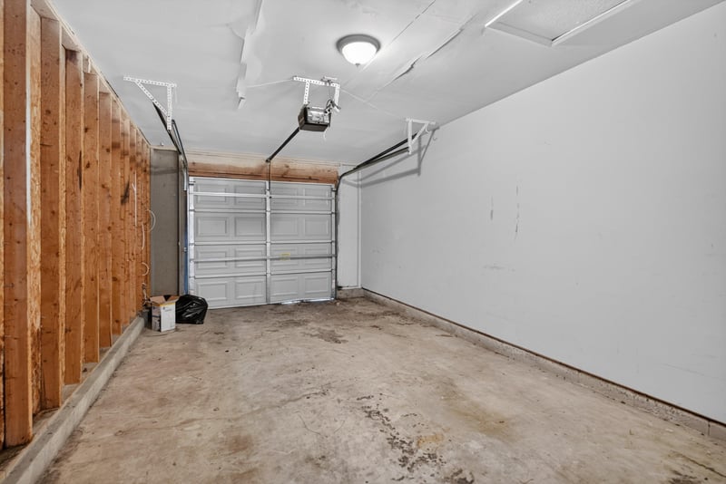 Garage interior with unfinished walls at 8010 International Village Dr, Jacksonville, FL 32277