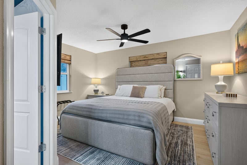 Primary bedroom with upholstered headboard at 1525 8th St N, Jacksonville Beach, FL