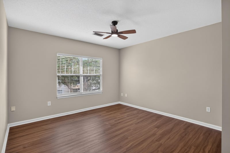 Bedroom with ceiling fan and window at 3750 Silver Bluff Blvd, Orange Park, FL