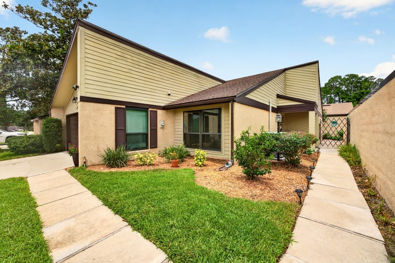 Front exterior with walkway and landscaped lawn at 3407 Fairbanks Grant Rd N, Jacksonville, FL 32223