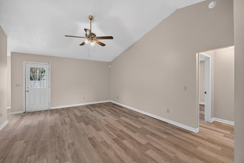 Entry foyer with vaulted ceiling and wood-look floors at 6646 Shiloh Creek Dr