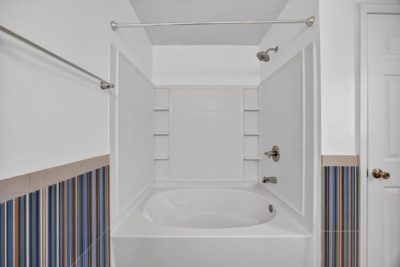 Primary bathroom tub and tile surround at 2282 Justin Lake Dr, Jacksonville, FL