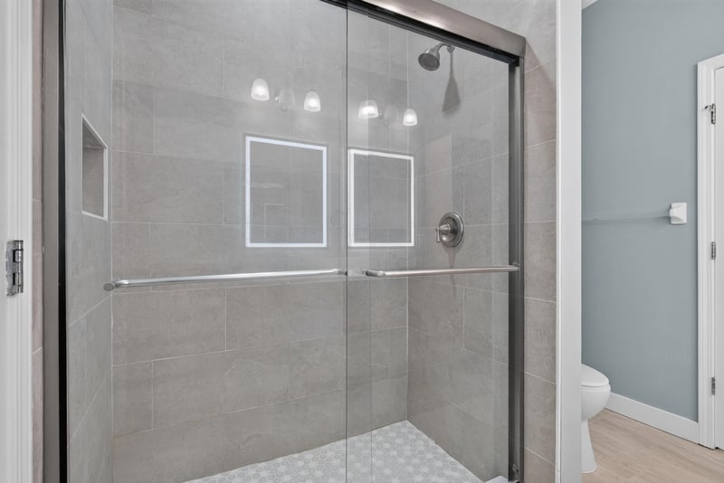 Primary bathroom glass-enclosed shower at 11251 Campfield Dr unit 1202, Jacksonville, FL 32256