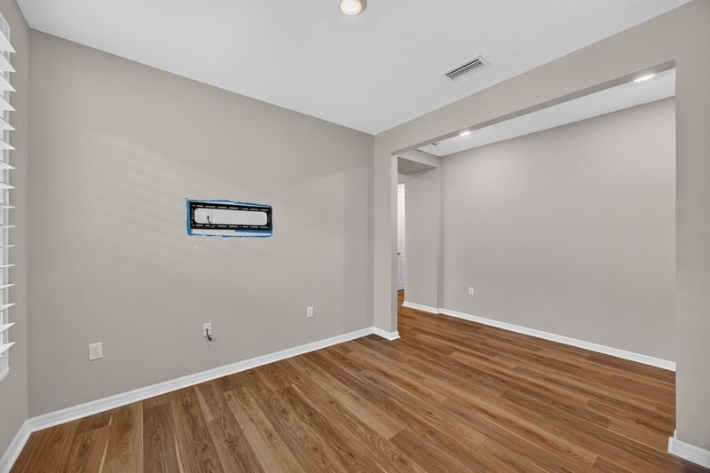 Open living space with wood floors and natural light at 171 Oyster Shell Ter, Nocatee, FL 32081