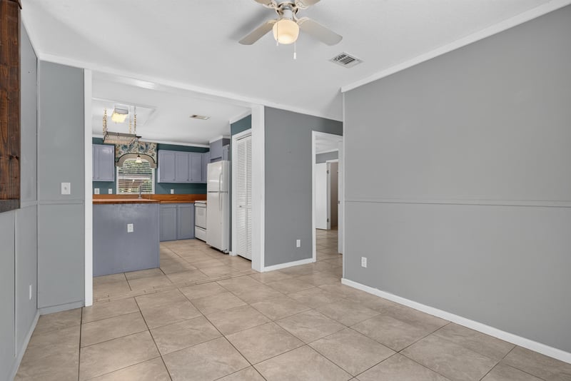Hallway opening into kitchen at 2549 Snapdragon Ave, Middleburg, FL 32068