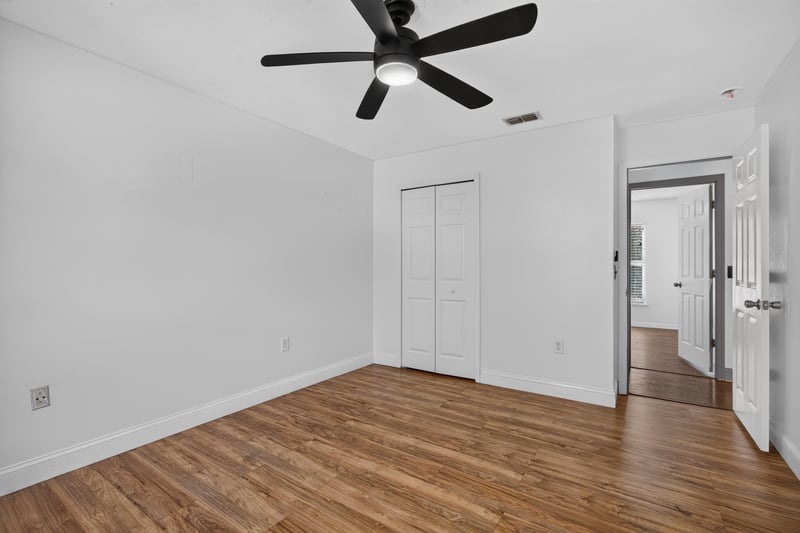 Bedroom with wood floor and closets at 3428 Glenn Hollow Ct, Jacksonville, FL 32226