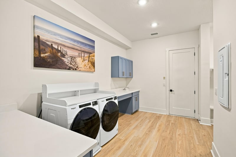 Laundry room with washer, dryer and cabinets at 907 Seagrove Dr, Ponte Vedra Beach, FL 32081