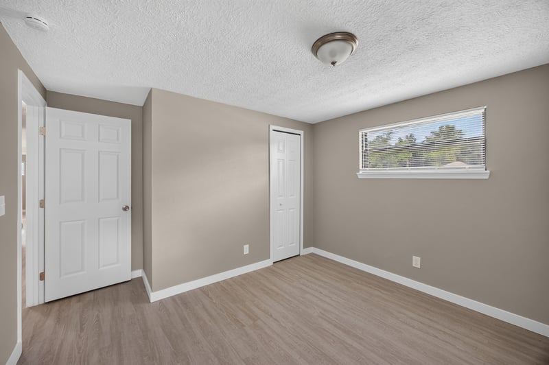 Empty room with closet door and window at 184 Draco St, Orange Park, FL 32073