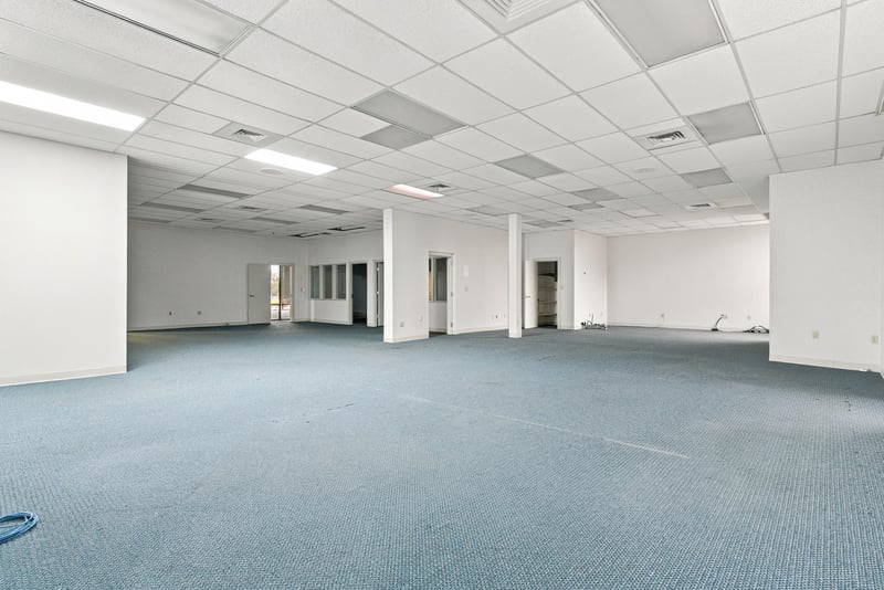 Open carpeted office space at 101 Scholars Wy