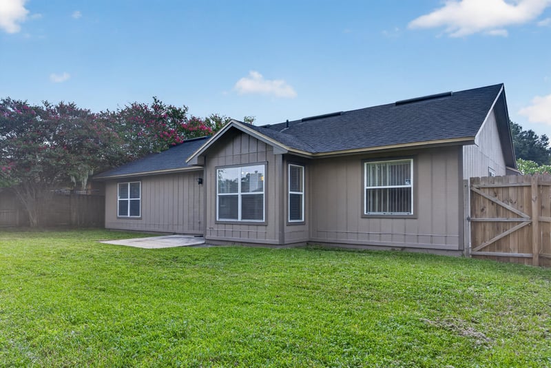 Side exterior view of home and landscaping at 6646 Shiloh Creek Dr