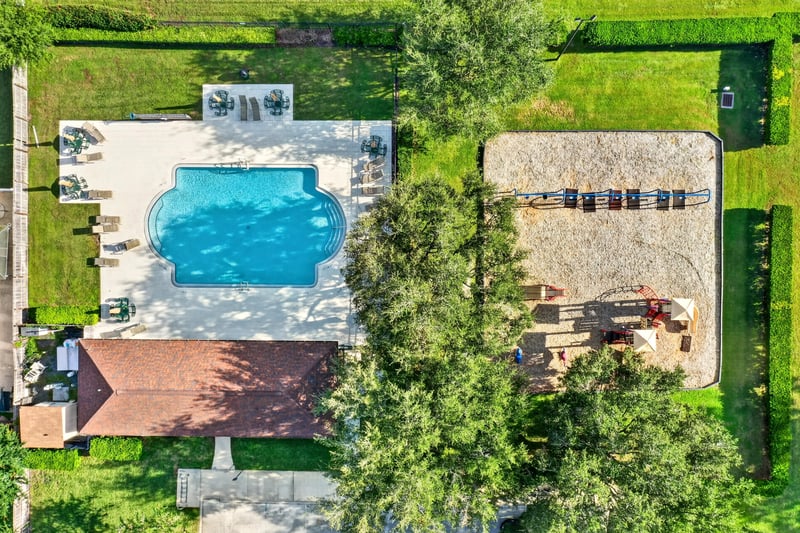 Aerial view of community pool and surrounding homes in Johns Creek