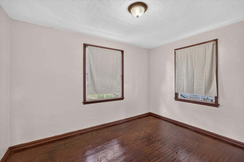Empty room with two curtained windows at 2132 Allandale Cir W, Jacksonville, FL