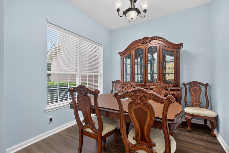 Dining room with wood table and china hutch at 3112 Silverado Cir, Green Cove Springs, FL 32043