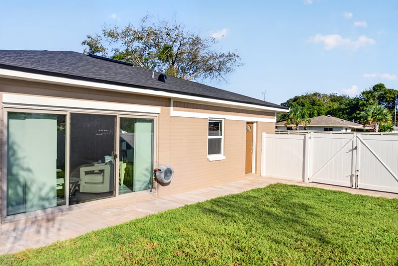 Backyard patio with sliding glass doors at 1525 8th St N, Jacksonville Beach, FL