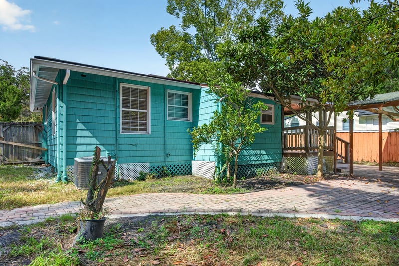 Side exterior of teal house with AC unit at 2841 Ernest St, Jacksonville, FL 32205