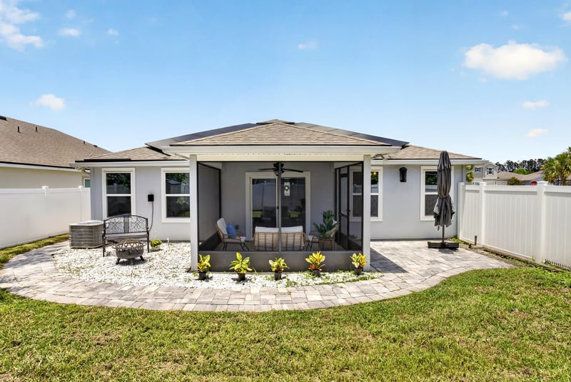 Aerial view of the screened porch and fenced yard at 10066 Andean Fox Dr, Jacksonville, FL 32222